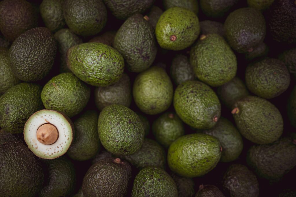 Fresh Avocado Wallpaper: Creamy Interior & Lush Green Background