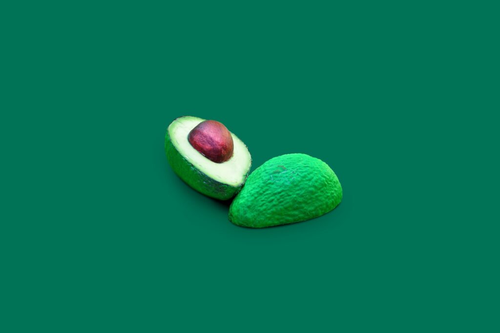 Fresh Green Avocado Wallpaper: Vibrant Split with Creamy Interior