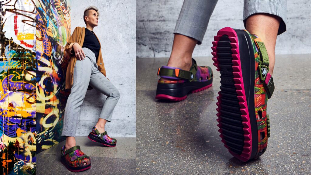 Aztec-inspired Crocs clogs with bold geometric patterns and chunky sole on urban backdrop Wallpaper