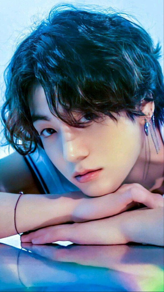 Stunning BTS Jungkook Wallpaper: Curly Hair & Vibrant Lighting Effects