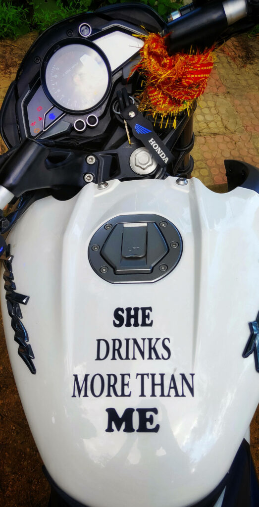 Humorous Bajaj Pulsar NS 200 Wallpaper: Fuel Tank & Vibrant Handlebars