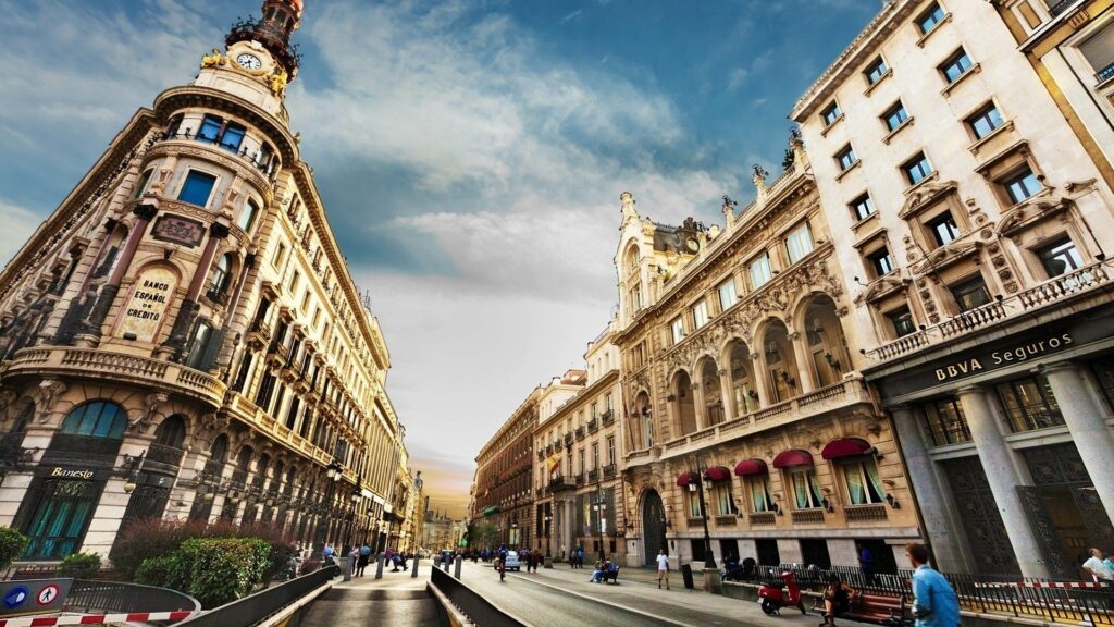 Vibrant Barcelona Street Scene Wallpaper: Historic Architecture & Sky