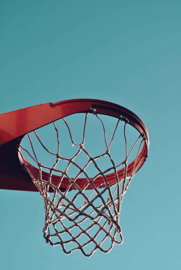 Vibrant Basketball Hoop Wallpaper: Sports & Freedom in Blue Sky