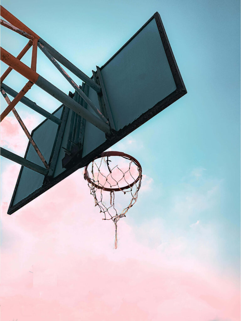 Vibrant Basketball Hoop Wallpaper Against Serene Gradient Sky