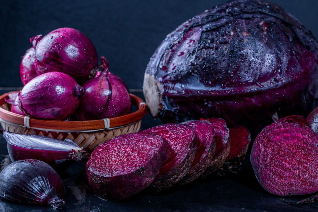 Vibrant Beetroot, Onion, and Cabbage Wallpaper on Dark Background