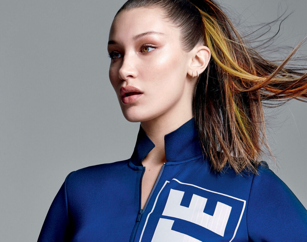 Vibrant Wallpaper of Bella Hadid in Stylish Activewear - Confident Look
