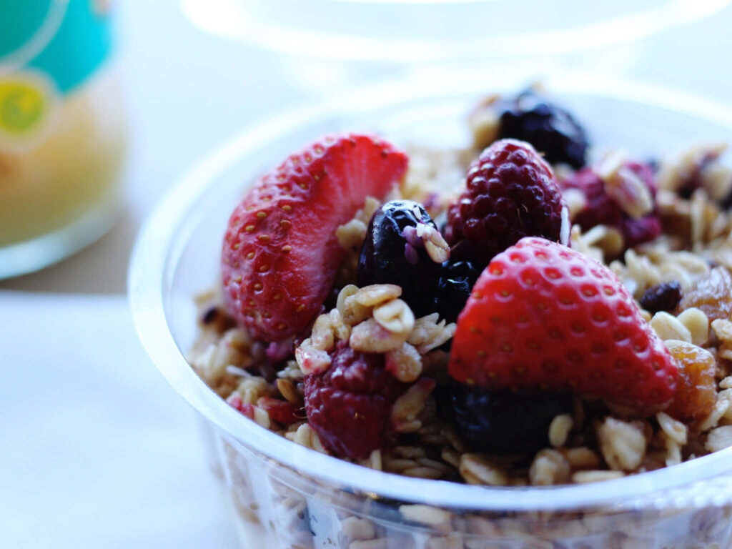 Vibrant Berry Bowl Wallpaper: Fresh Strawberries, Raspberries & Granola