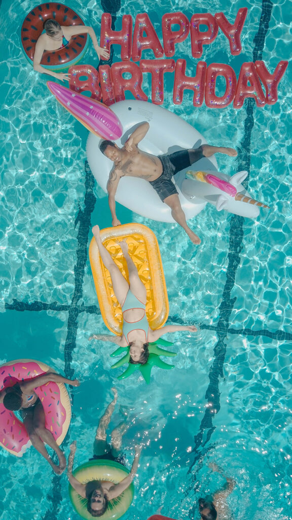Vibrant Birthday Celebration Wallpaper: Friends & Fun Pool Floats