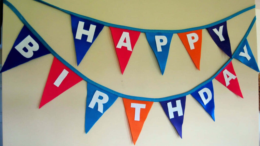 Colorful Birthday Banner Wallpaper with Triangular Flags & Bold Letters