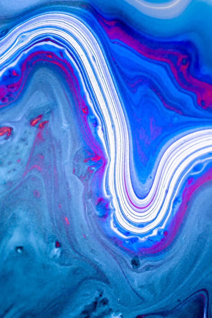 Vibrant Blue Abstract Fluid Art Wallpaper with Swirling Patterns