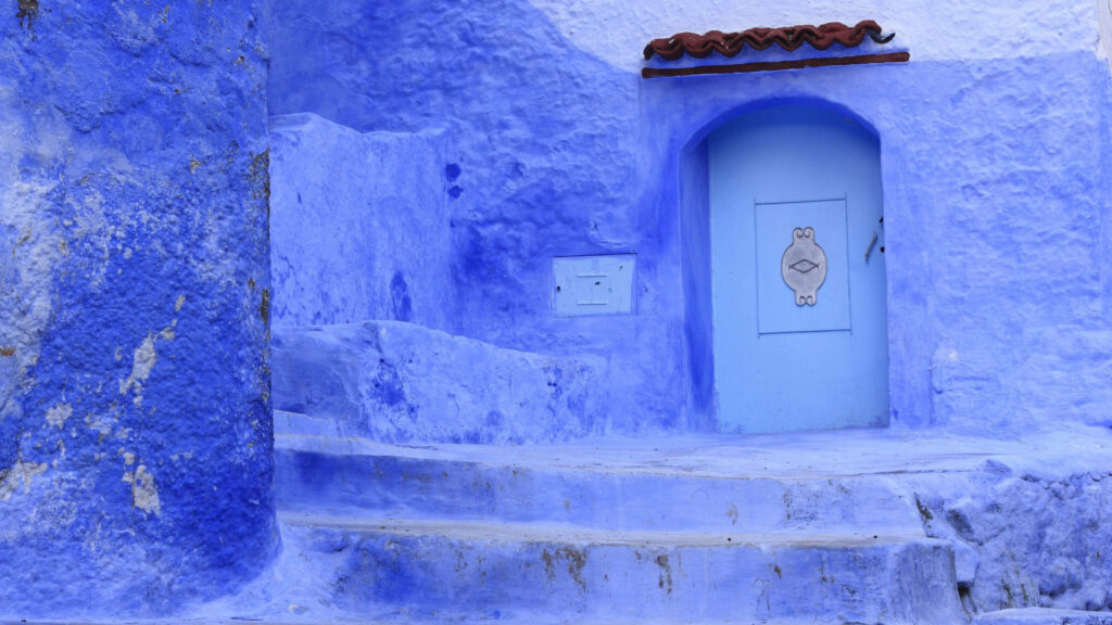 Stunning Chefchaouen Blue Wall Wallpaper - Serene Moroccan Architecture