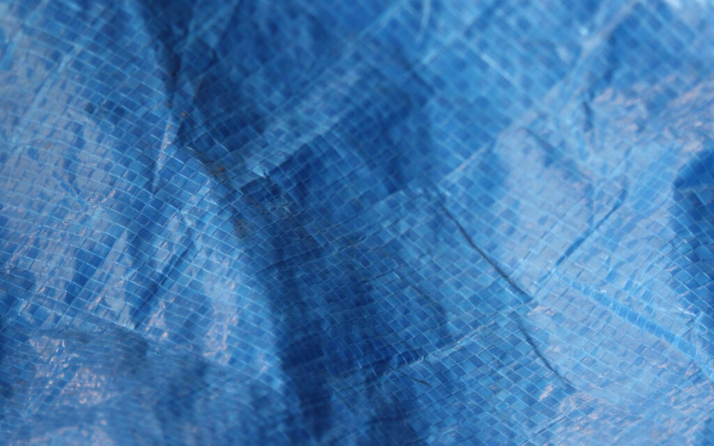 Dynamic Blue Crumpled Grid Wallpaper Background - Vibrant Texture
