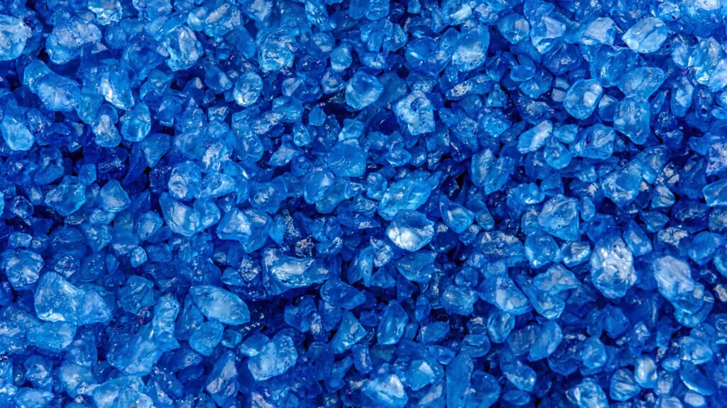 Vibrant blue crystal rocks wallpaper with rich textures and vivid natural crystalline patterns