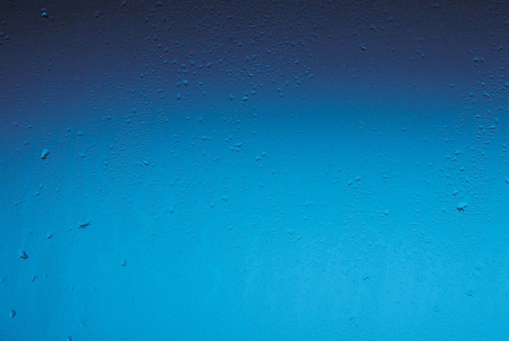Modern Blue Gradient Wallpaper with Textured Glass & Water Drops