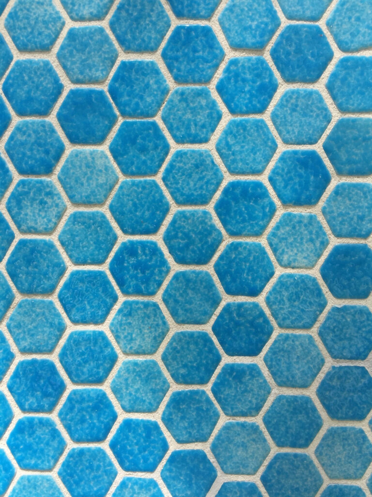 Modern Blue Hexagonal Tile Wallpaper with Textured Geometric Pattern