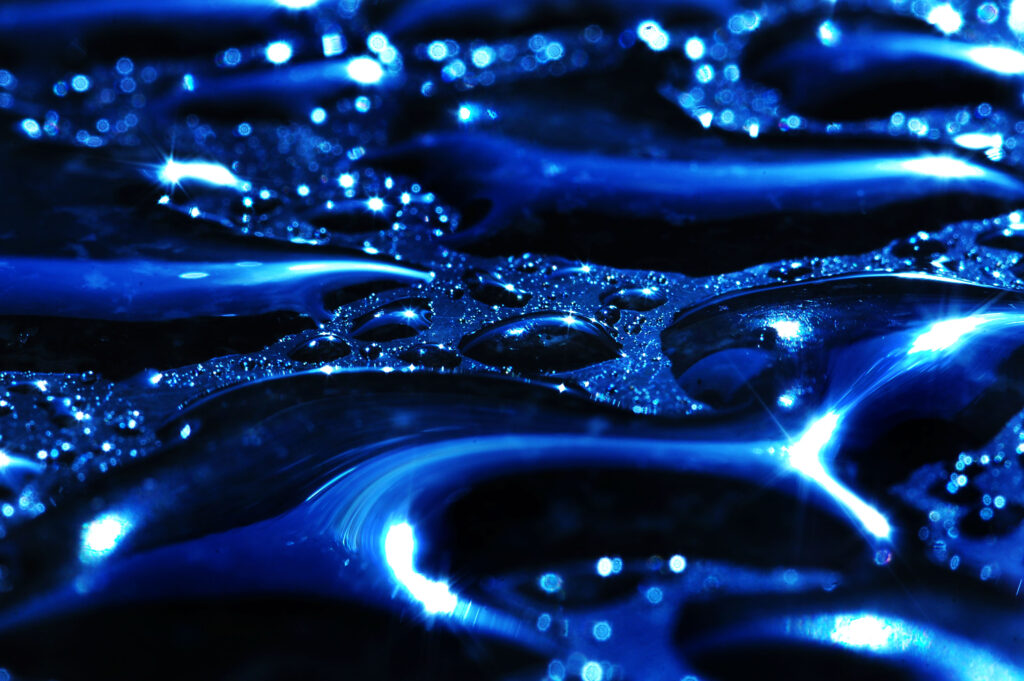 Vibrant Blue Moisture Drops Wallpaper Background - Glistening Close-Up