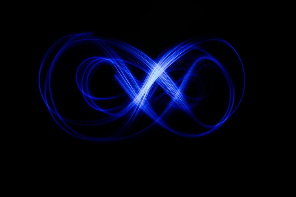 Vibrant Abstract Wallpaper: Long Exposure Blue Neon on Black Background