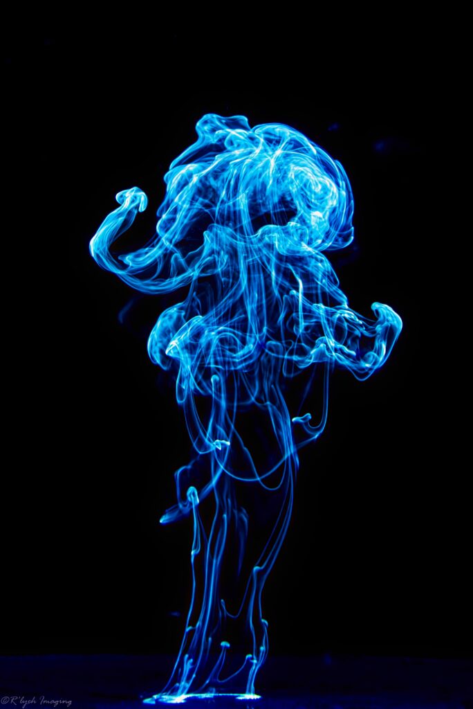 Vibrant Blue Smoke Abstract Wallpaper on Deep Black Background