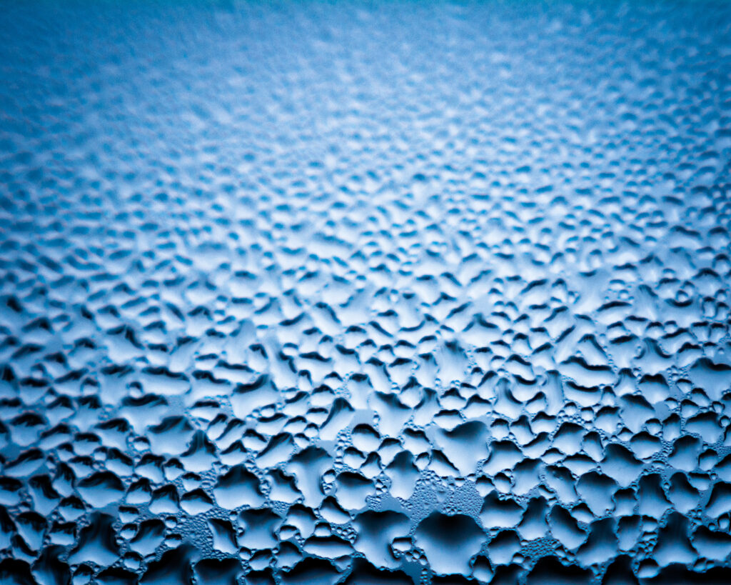 Vibrant Blue Macro Water Droplets Wallpaper Background