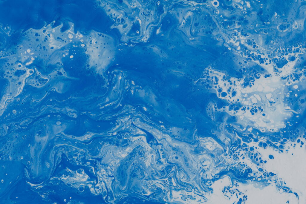 Blue Watercolor Stains: Vibrant Paint Spots Transforming into Mesmerizing 5K Wallpaper Background