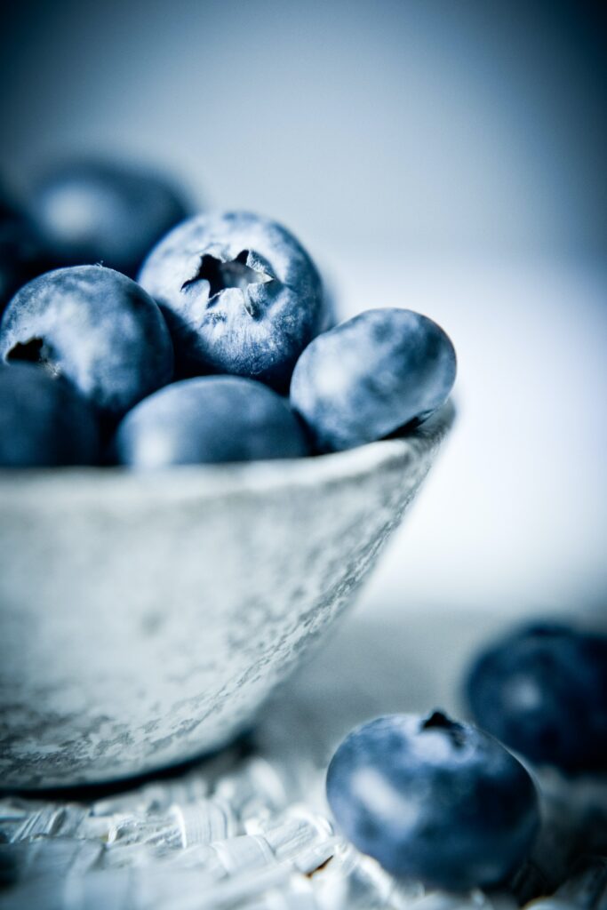 Vibrant Blueberries in Textured Bowl - Stunning Wallpaper Background