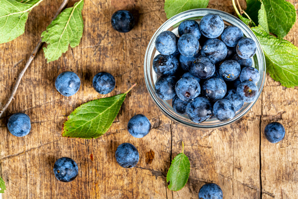 Vibrant Blueberry Wallpaper: Fresh Berries on Rustic Wood Background