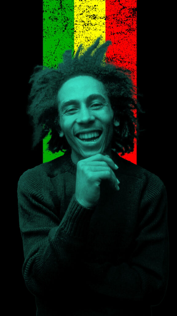 Bob Marley smiling against textured reggae green yellow red background radiating positive energy Wallpaper