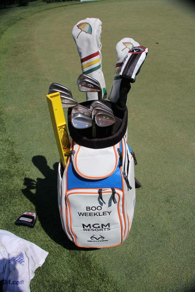 Vibrant Boo Weekley Golf Bag with Custom Covers on Lush Course Wallpaper