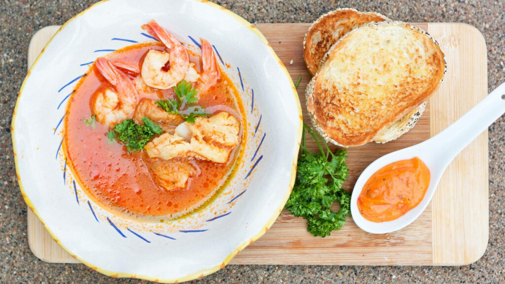Vibrant French Bouillabaisse Wallpaper with Seafood & Toasted Bread