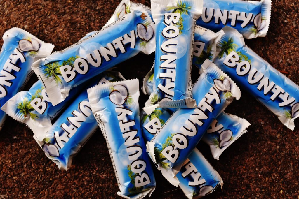 Vibrant Bounty Candy Bar Wallpaper: Tropical Coconut Treat Background