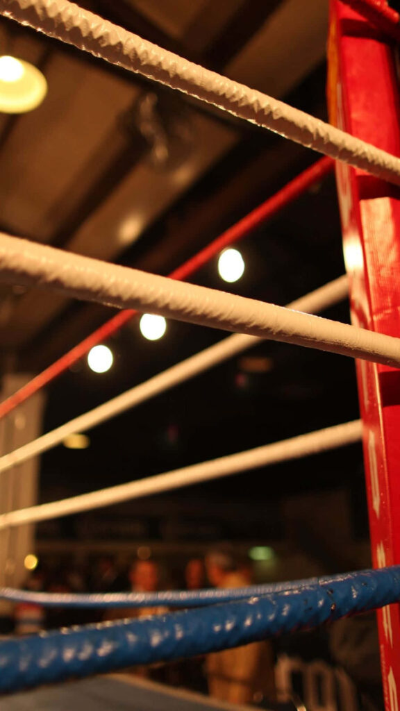 Vibrant Boxing Ring Wallpaper: Red, White & Blue Ropes Atmosphere