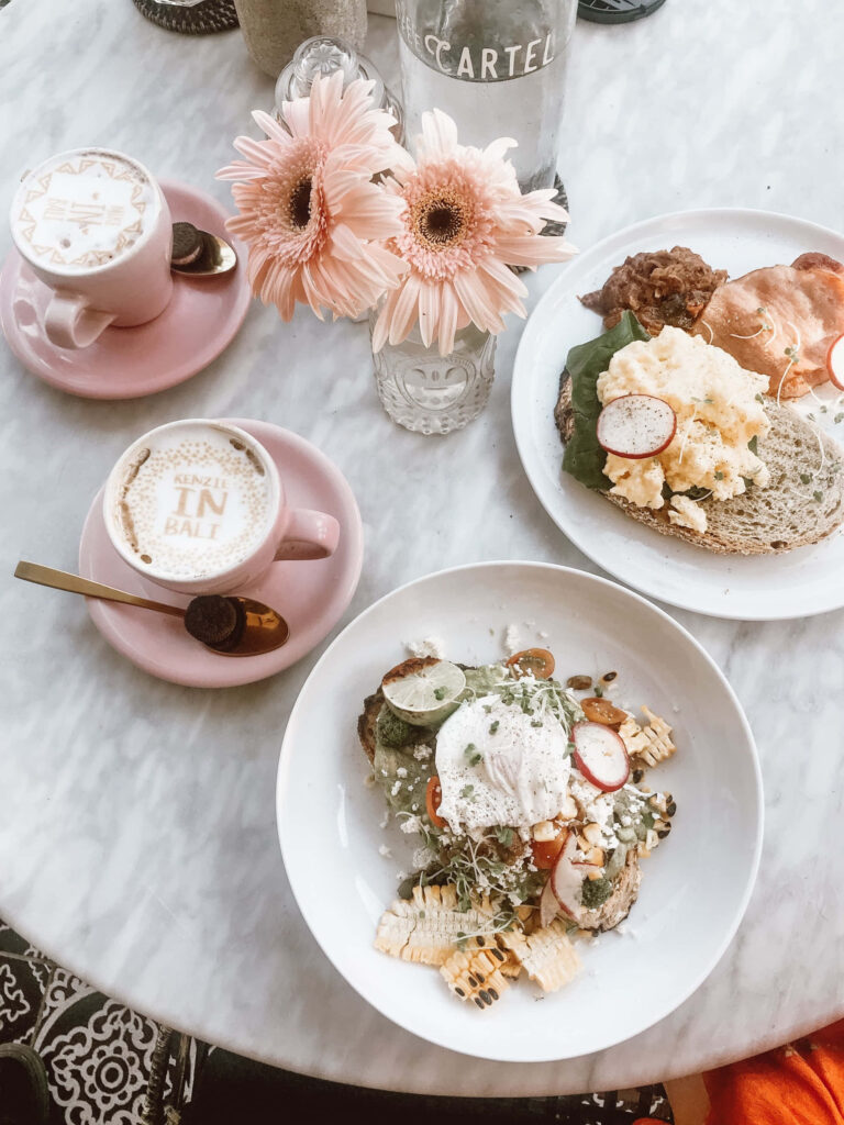 Charming Breakfast Table: Avocado Toast, Coffee & Floral Decor Wallpaper