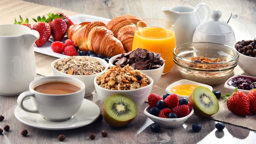 Cheerful Breakfast Wallpaper: Vibrant Coffee, Fruits & Pastries