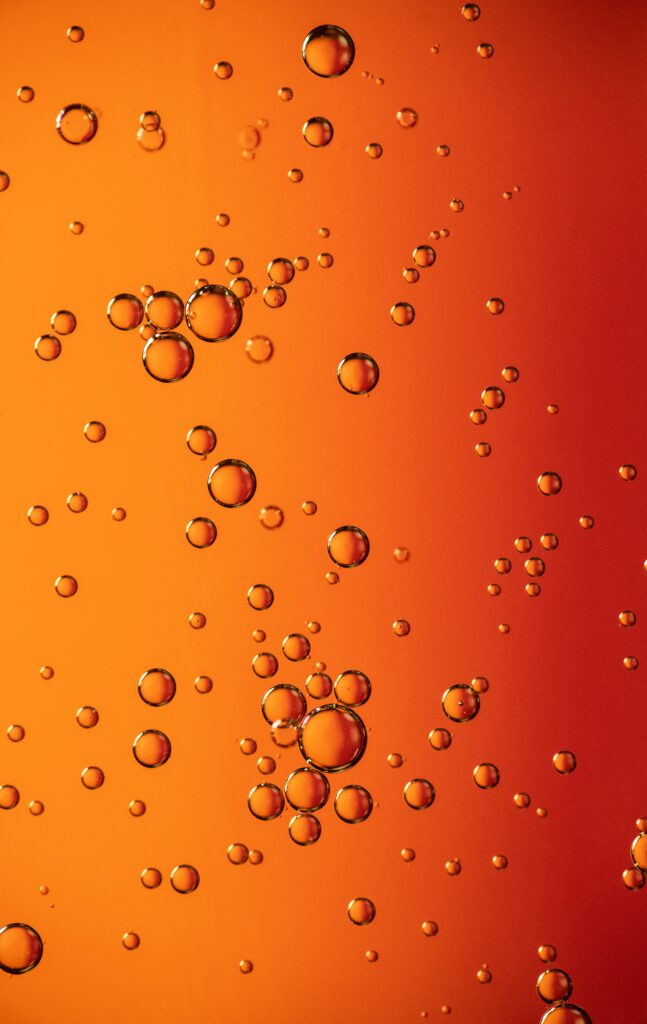 Vibrant Bubble Wallpaper: Dynamic Orange Gradient Background Art