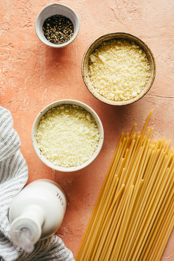 Vibrant Cacio e Pepe Wallpaper: Grated Cheese, Pepper & Pasta