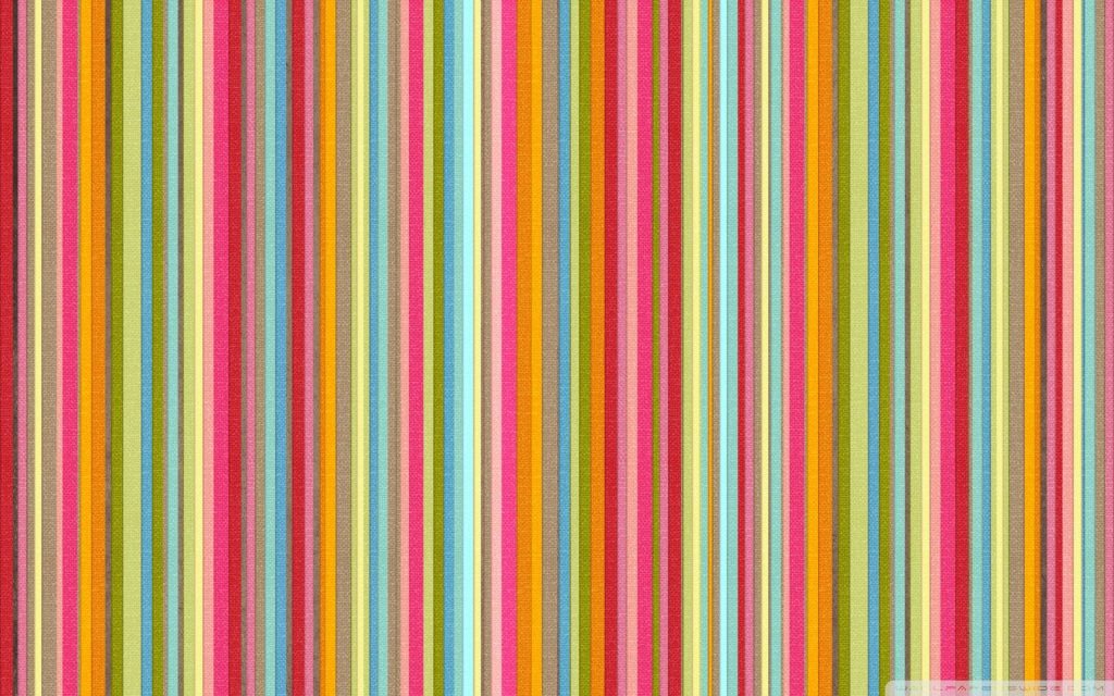 Vibrant vertical candy-colored stripes wallpaper with fabric texture in bright pink green orange red and turquoise