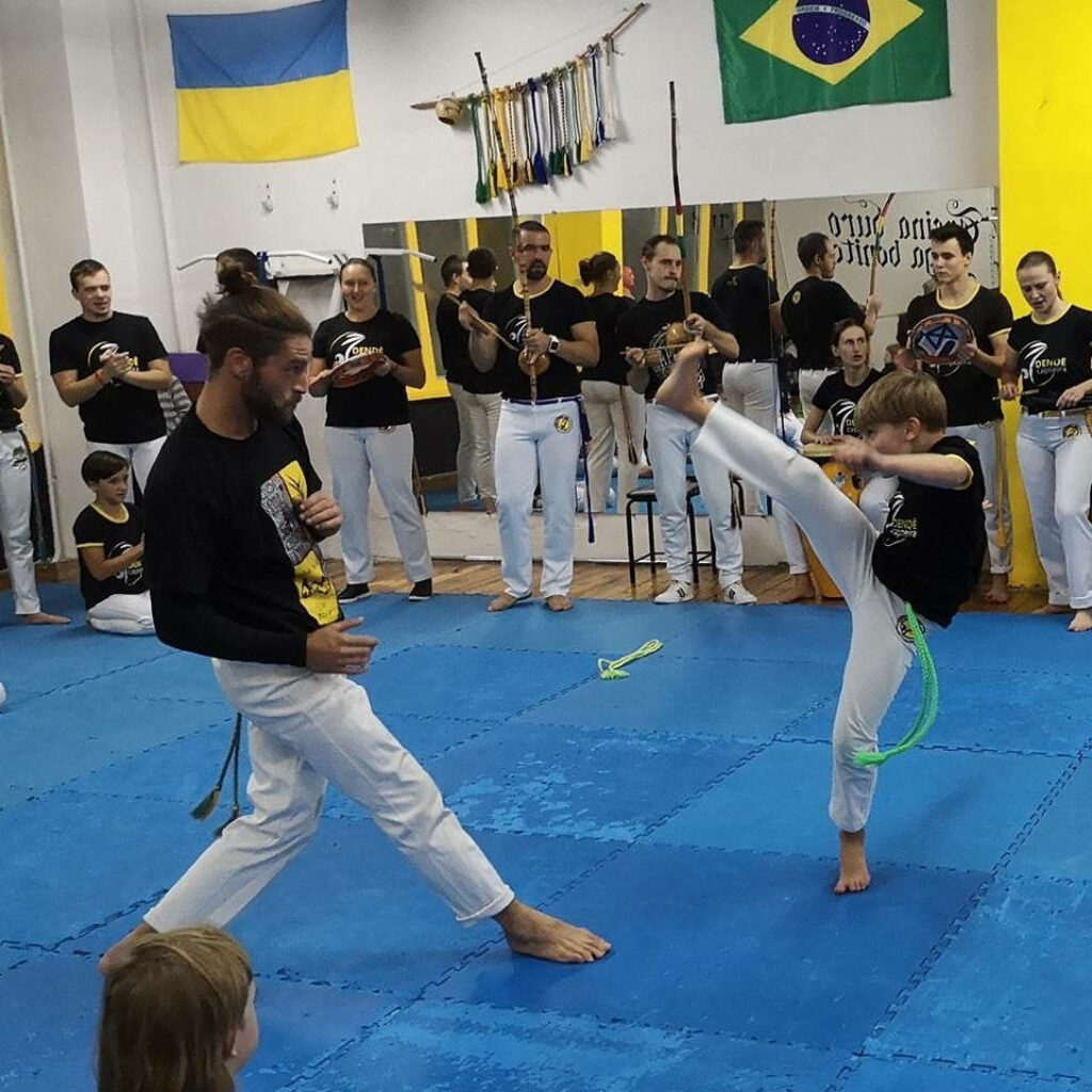 Vibrant Capoeira Training Session in Gym - Dynamic Martial Arts Wallpaper