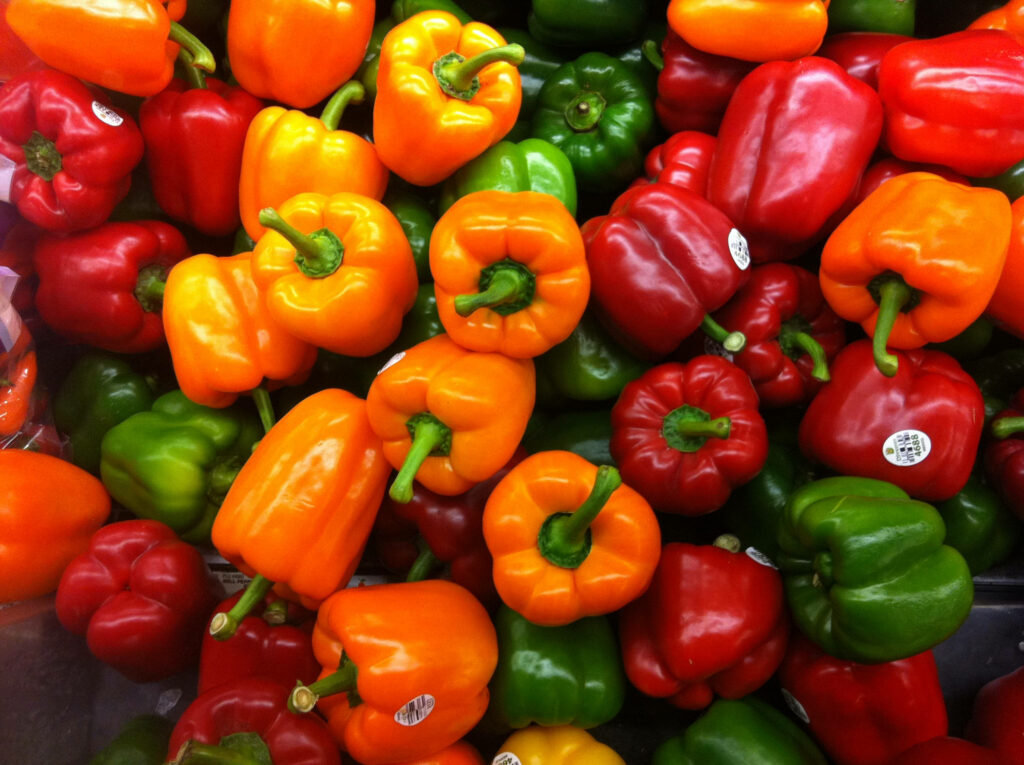 Vibrant Capsicum Wallpaper: Colorful Top-View Background