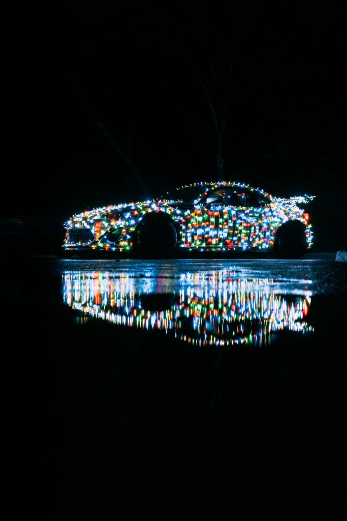 Vibrant Car Lights Reflection on Wet Surface at Night Wallpaper