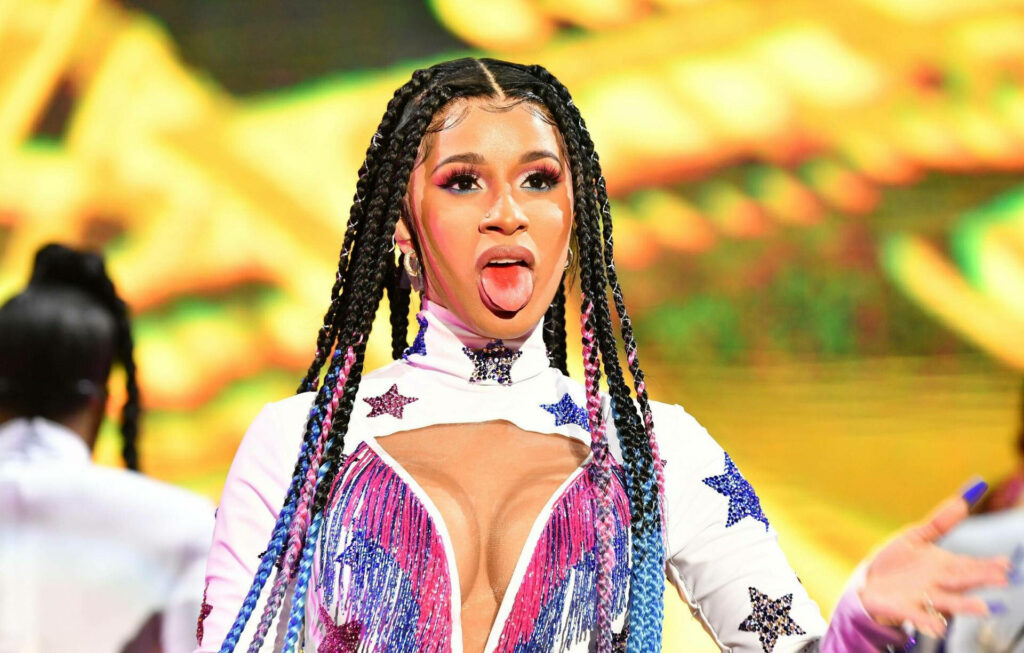 Vibrant Cardi B Wallpaper: Bold Star-Print Jumpsuit & Colorful Braids