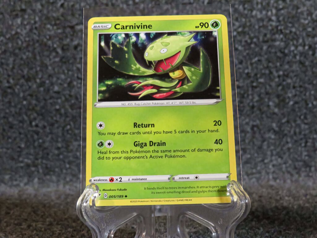 Vibrant Carnivine Pokémon trading card wallpaper with bold green hues and dynamic artwork