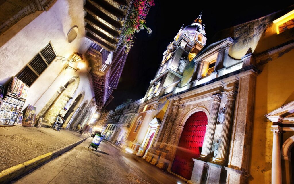 Vibrant Cartagena Night: Stunning Wallpaper Background of Historic Streets