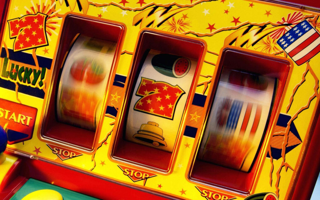 Close-up vibrant slot machine wallpaper with bright yellows reds and starburst jackpot graphics