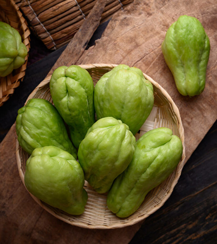 Rustic Chayote Squash Display: Vibrant Green Wallpaper Background