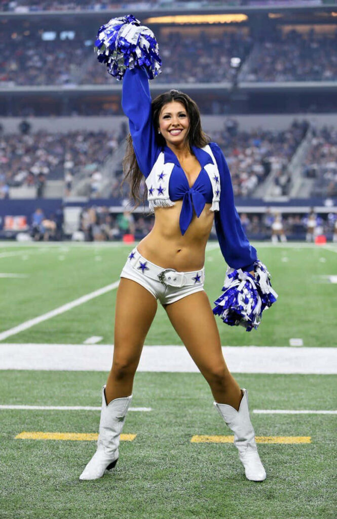 Vibrant Cheerleader Dance Wallpaper: Energetic Sports Event Scene