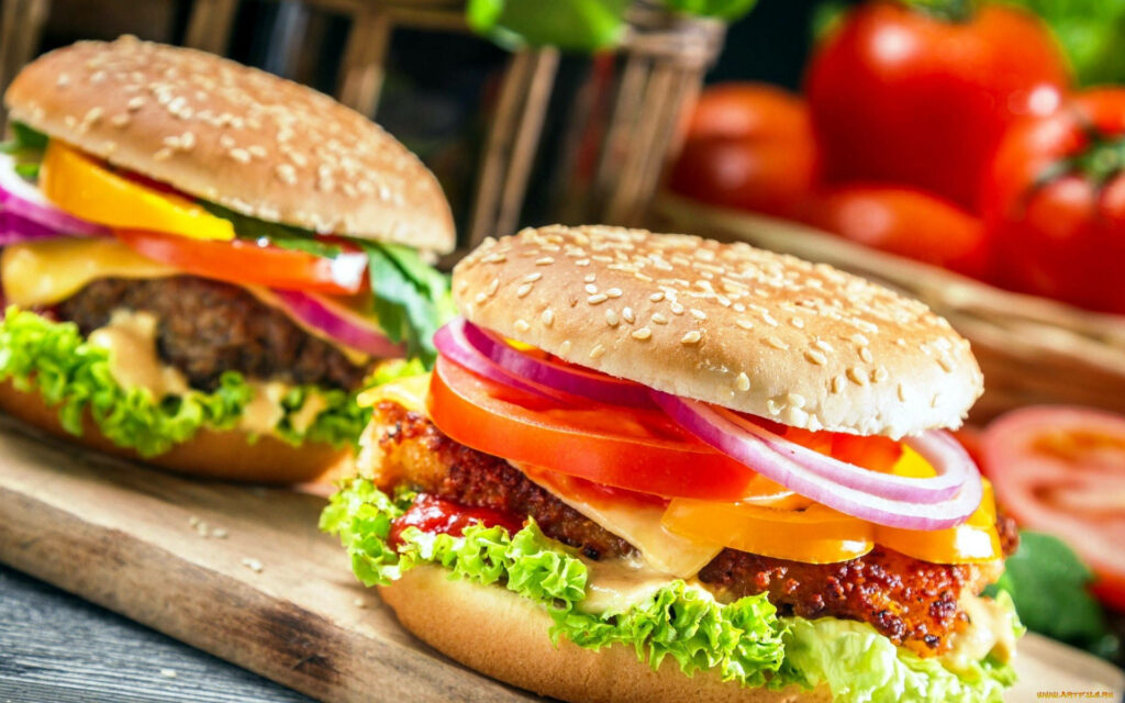 Vibrant Cheeseburger Wallpaper with Fresh Veggies & Sesame Buns