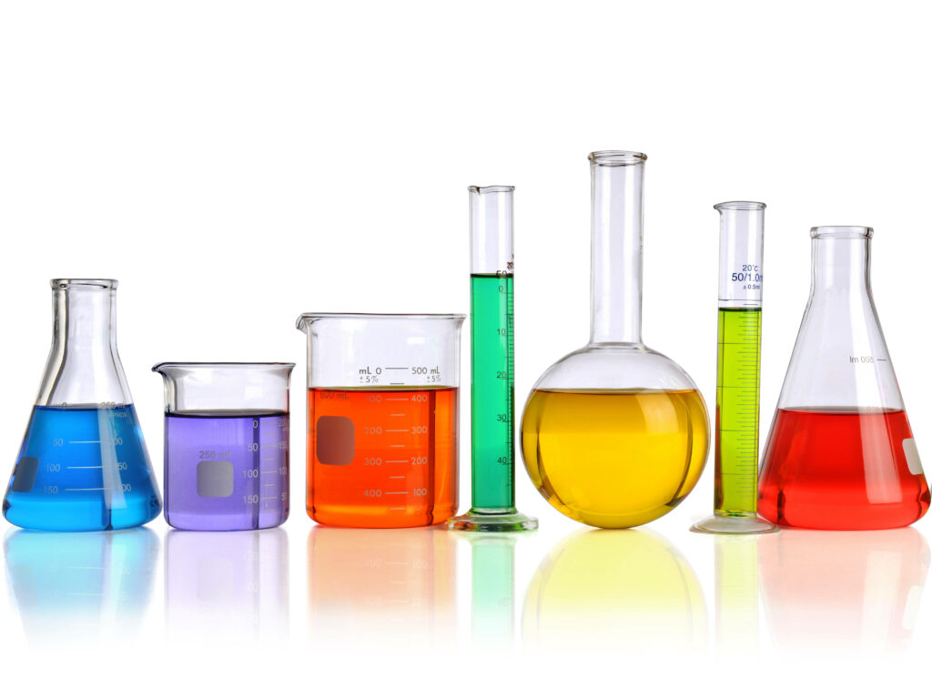 Colorful laboratory glassware with blue orange green yellow and red liquids on white background Wallpaper