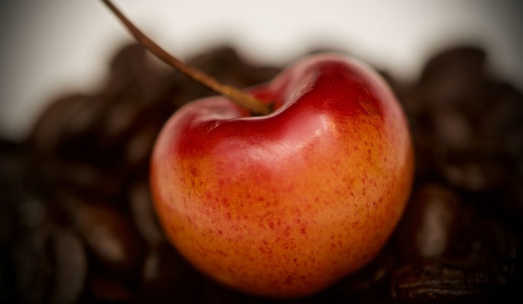 Vibrant Cherry Macro Shot: Red & Yellow Wallpaper Background