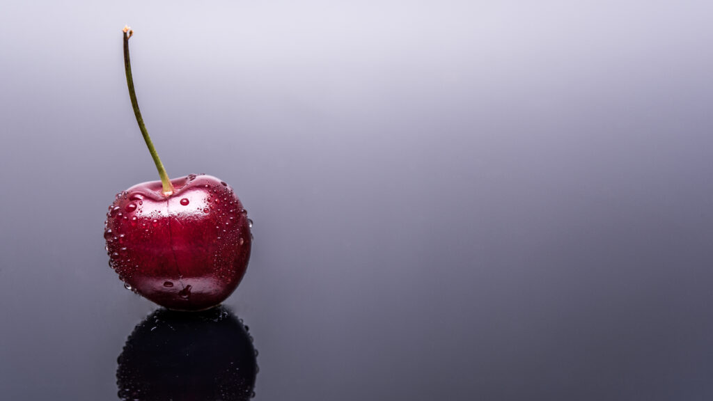 Glossy Cherry Macro with Water Droplets - Vibrant Wallpaper Background