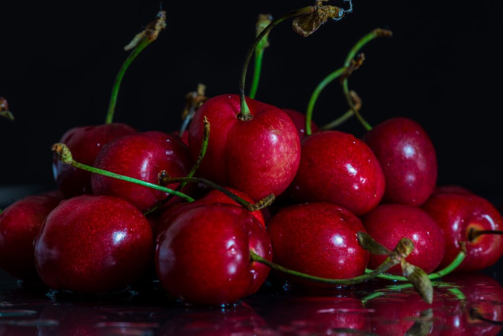 Juicy Red Cherries Wallpaper: Fresh and Vibrant Background Design